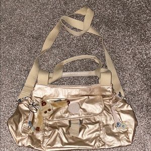 Golden crossbody Kipling bag
